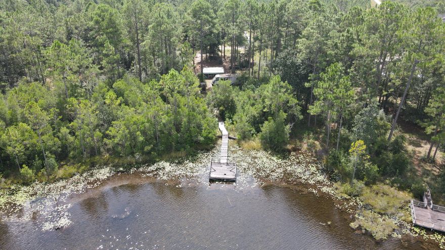 Lake front property. Perfect homesite for your fishing enthusiast. 45 Minutes to the beach, even closer to the Choctawhatchee Bay, and even closer to many rivers and creeks.