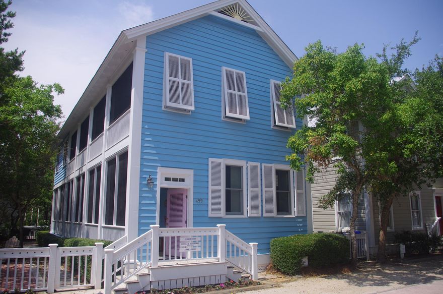 This light filled, spacious cottage is a family dream house. Built in the classic Seaside style and located close to pool, play ground and fitness center. The house speaks comfort and easy living. A wall of French doors opens the capacious main floor living area onto a screened porch that runs the full length and wraps around the house. The 30' x15' living and dining room features 10' ceilings, beadboard walls and a fireplace surrounded with book cases. The mix of antique and beach chic furnishings complement each other. Crown molding and oak floors used throughout the house. The kitchen has a pass though to the dining room and includes black and white tile floors, granite countertops and stainless steel appliances. Half bath and laundry room also on first level. Upstairs, the