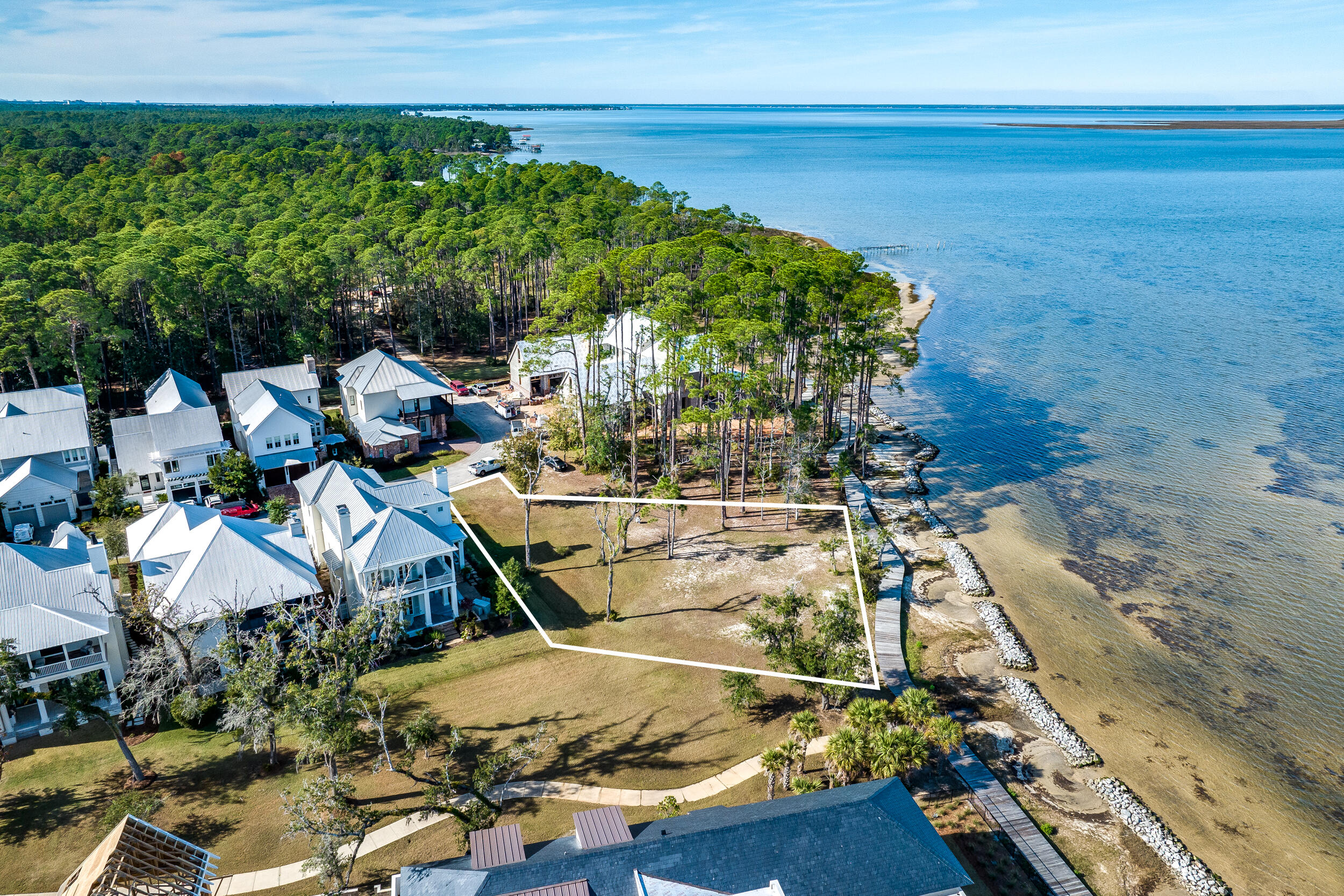 Last opportunity to build on the Bay in Churchill Oaks! This large double lot, boasting 110 feet of frontage on Choctawhatchee Bay, is tucked away on a quiet street with ample room to build your dream house. Churchill Oaks is a beautiful gated community nestled on 40 acres in the bend of Churchill Bayou and Hogtown Bayou in the Choctawhatchee Bay. The community is complete with its own private deep water marina. A 70 ft boat slip can be purchased separately.