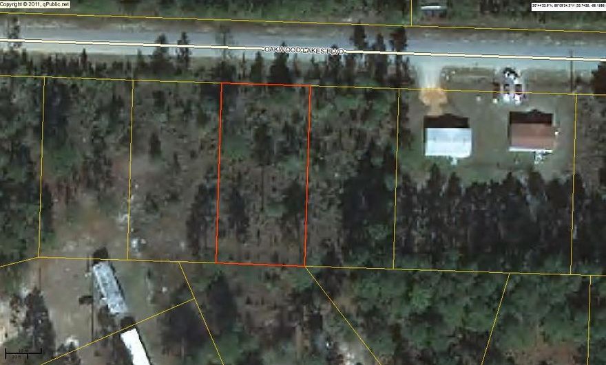 One of 4 consecutive lots on desirable Oakwood Lakes Blvd. These lots are located on a paved road just outside city limits. Tap fee and impact fee have already been paid. Power on road; will require septic tank. Make an offer on one or on all four!