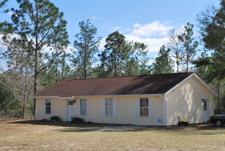 BACK ON THE MARKET!! Welcome home to this 4 bedroom, 2 bath home on a FULL acre! This sweet little property is close to shopping and schools in North Crestview, but has a quiet, country feel, The converted garage made room for another bedroom and an office/work area. The galley kitchen has a smooth top range, dishwasher, and built in microwave. The door in the dining room leads out to the fenced in back yard. It's perfect to keep your fur babies safe and secured. This property also features a massive 30 x 30 workshop. Tim the Tool man's work-space has nothing on this one! The shop has it's own power pole with 200 amp service, central heat and air, spray foam insulation throughout, footers in one bay for a 2 post lift, and cable wired from the house to the shop for TV, 50' flat screen, and a pioneer stereo with wall mounted speakers.  Need we say more?  Call today to make an appointment to see this property!  Buyer to verify any measurements and information deemed important.