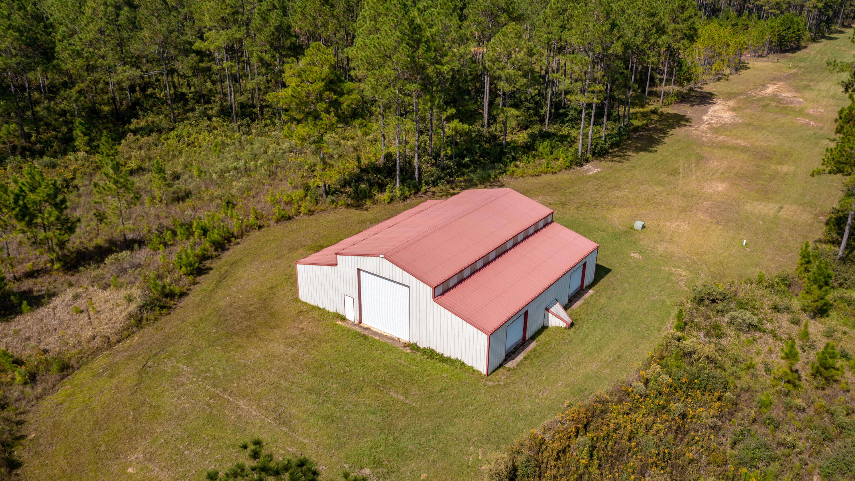 Looking for your own getaway from the business of the city? This 79+ acre property is it! Whether you like hunting or just peace and quiet, you definitely want to check this one out. There is a massive barn that will convey with the sale. Property has electricity already run to it as well as an 187 ft deep well that can be accessed just outside the MASSIVE 60x60 barn! Schedule your showing today.