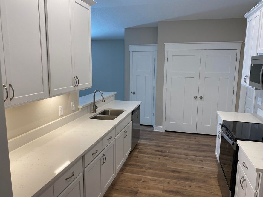 Enjoy this never lived in completely new home!  You'll relax in this spacious open floor plan with a separated master suite.  The kitchen and bathrooms all have matching quartz countertops and there is luxury vinyl plank flooring in the common areas.  The home is loaded with cabinet space and you'll enjoy the newly added privacy fence.  Unfortunately the insurance policy does not allow pets. Schedule your private viewing today!