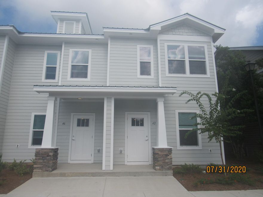 This beautiful, 3 bedroom, 2.5 bath end unit town home with upgrades and a community pool! This lovely home is across the street from an elementary school, just down the road from a Publix shopping center, and a short, easy commute to the sugar sand beaches and emerald waters of 30a/SOWAL. It has fresh, neutral paint and no carpet throughout. The open floor plan on the first level includes a nice size living room with nook, eat-in kitchen with breakfast bar, gorgeous counter tops, plenty of counter/cabinet space, stainless appliances (including a flat cook top stove), and beautiful back splash, as well as a half guest bath with pedestal sink and a screened-in back porch.