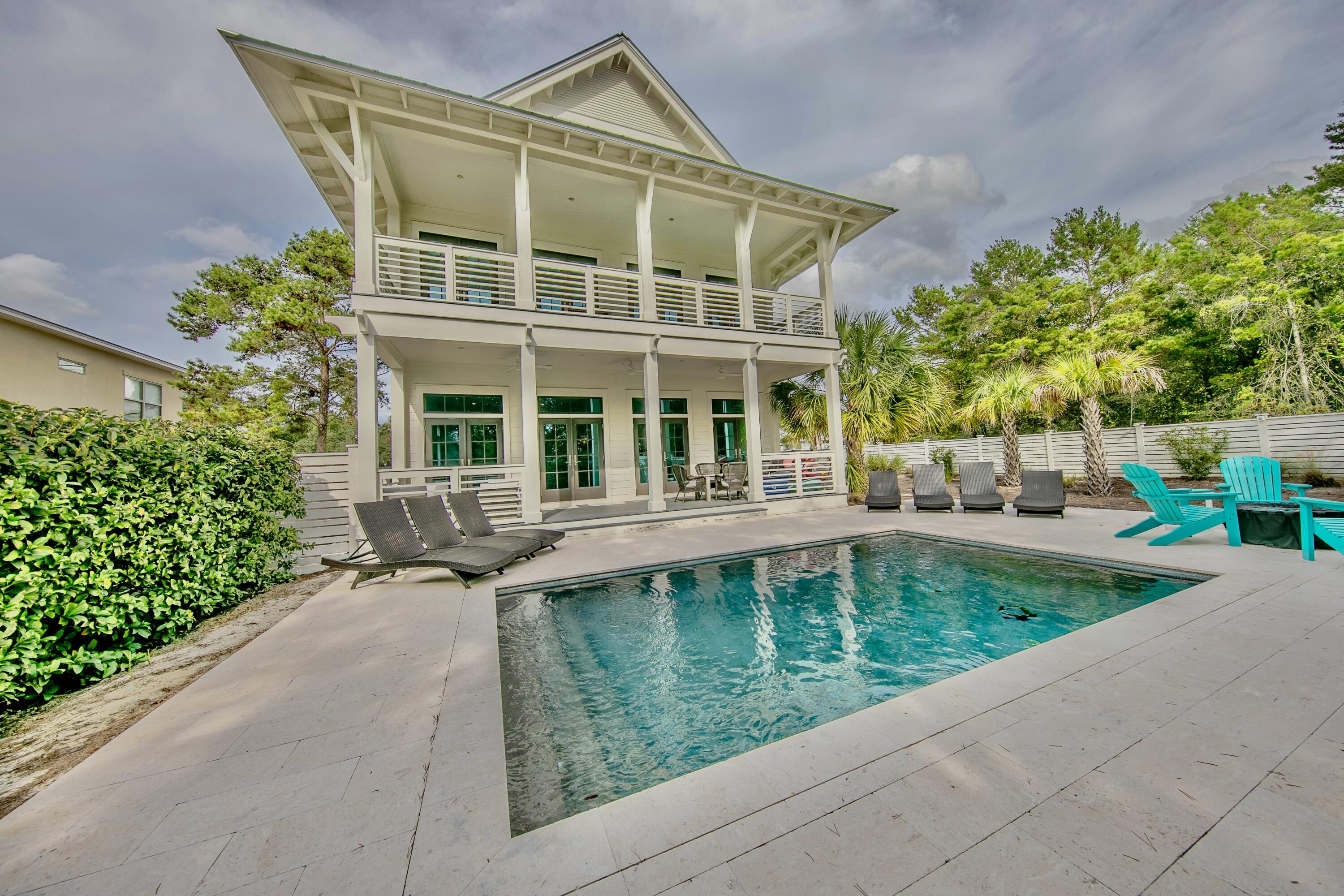 Dream vacation home south of 30A with rental projections of $180K! Enjoy this gorgeous 3,664 square foot home built in 2022 that boasts 6 bedrooms, 6.5 bathrooms and ample gathering space for family and friends. Designed with peaceful retreats in mind, you will quickly be swept into coastal chic living upon passing through the entry way and entering the great room. The heart of the home features an oversized living area connected to a dream kitchen and dining area, all of which are perfect for generations to gather, dine and play games for hours. Walk out the living room door to the private outdoor retreat with a large patio and beautiful pool. The oversized lot and lush landscaping make the outdoor space a private retreat.