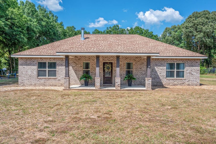 Built in 2020, this stunning custom home offers the perfect blend of modern upgrades and timeless charm. Featuring 3 spacious bedrooms and 2 full baths, every detail has been thoughtfully designed. From the upgraded cabinetry & beautiful granite countertops throughout, to the cozy all brick fireplace and custom tile shower in the primary suite. Enjoy quiet mornings on the charming front porch or relax and entertain on the large back porch overlooking your 1+ acre tree-lined lot.Car enthusiasts, hobbyists, or anyone needing extra space will love the impressive 40x48 workshop on a concrete slab, two oversized roll-up doors, with water & electricity in place. Ready for all your projects and storage needs! Experience the lifestyle this home offers! Book your tour before it's gone.