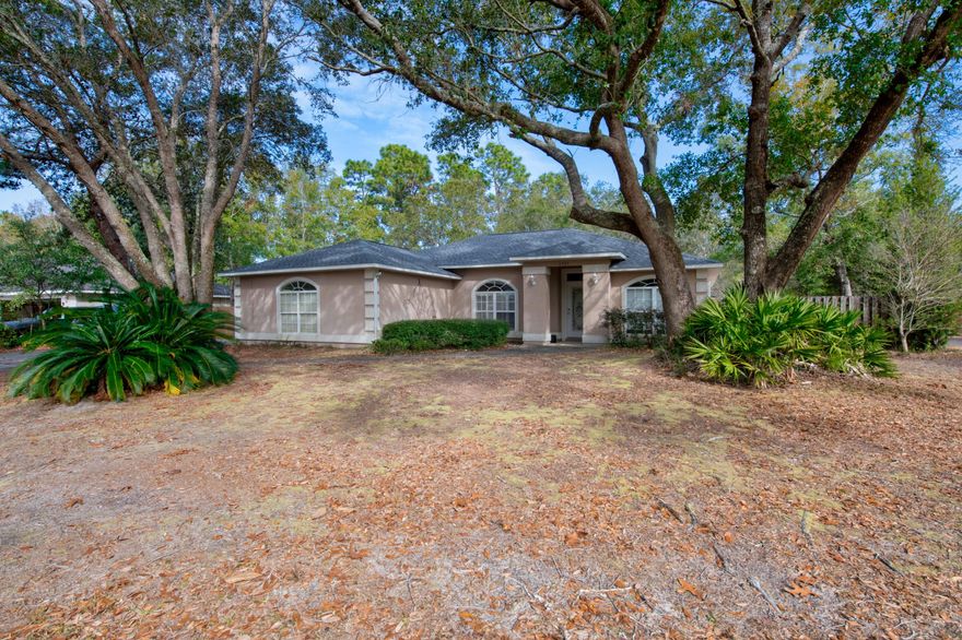 Inviting 3 Bedroom/2 Bath home in one of the most established and desirable neighborhoods in the area, ROBLEDAL ESTATES! This property sits on a large 1/2 acre lot with beautiful trees and lots of privacy. The home features an open concept, split floor plan with high/vaulted ceilings. Home has a NEW 3-dimensional shingle roof and 1-YEAR OLD water heater. New carpet has been installed in the all bedrooms, and the main living areas of the house features Karndean luxury vinyl flooring. Faux wood blinds and/or shutters have been installed throughout the home. The master bedroom is spacious and boasts a trey ceiling and tons of natural light. The master bath features doubles vanities and closets, as well as a garden tub.