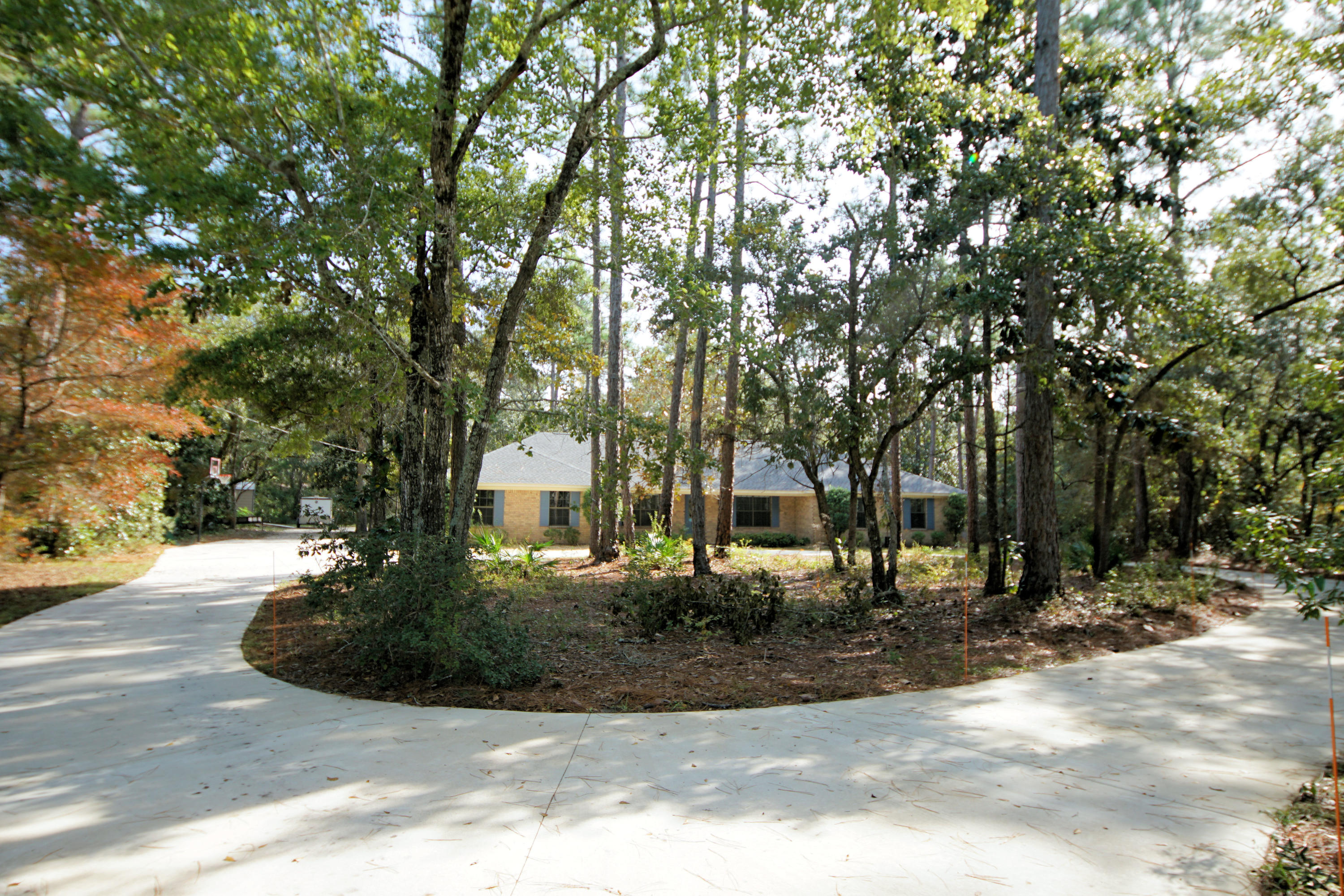 This is such a great opportunity to own a beautiful home which has been DRASTICALLY REDUCED. Seller is Motivated! If you want a beautiful brick home on almost an acre private lot with a marina, park and boat launch just minutes from your house, this is your chance. Roof replaced in June 2015! Close to schools, shopping, bases and the beaches! - 4 bedrooms, 3 baths, dining room PLUS a den/office. Kitchen with granite countertops, new appliances including a gas stove. A mother-in-law suite. A separate workshop with a new circular driveway that has room for an RV and up to 5 cars. Oversized 2-car garage. This house has everything you are looking for... It just needs YOU to make it your HOME. Call me to schedule a tour today!