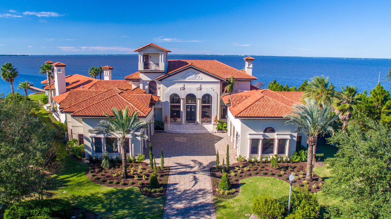 FEATURED ON HGTV'S EXTREME HOMES!! DRASTIC PRICE REDUCTION FOR RAPID SALE!! Welcome to 4300 Breakwater Drive, Destin, Florida's Most Prestigious Waterfront Estate! This magnificent home is of a spectacular Tuscan Villa style that is truly a work of art! Situated on indisputably the finest bay-front lot in all of Destin, the sprawling 1.8 acre estate is located in the exclusive gated neighborhood of Waterford in Kelly Plantation and is a masterpiece beyond compare, with over 410' of water frontage on the Choctawhatchee Bay and Jones Bayou. Custom built using the finest of materials and technology, this estate reflects elegance and sophistication. A brick-paved motor court leads to the dramatic arched limestone entrance, flanked by two lion sculptures and iron Cantera doors...