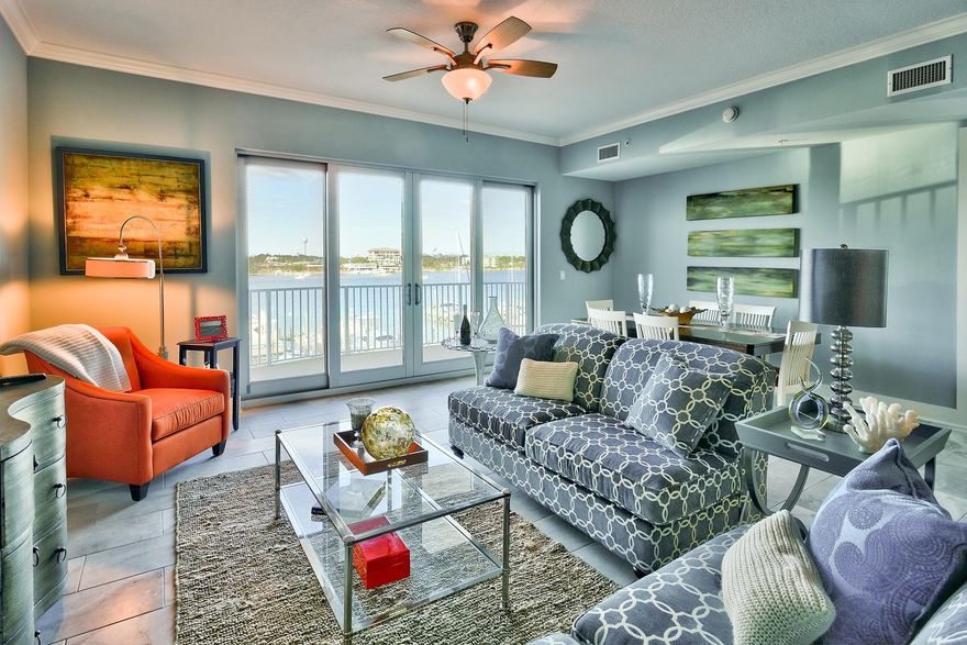 INVESTOR CLOSEOUT SALE!!! Do not miss out on this incredible opportunity to own in Harbor Lights, a beautiful, prominent 7-story condominium nestled on the Destin Harbor with luxurious amenities and views. This 2BR/2BA unit comes with a 1-car garage #13 and climate controlled storage room #13. Interior was just renovated and features stunning new porcelain tile floors in the entry, kitchen, living area & bathrooms. There is new carpet in the bedrooms, fresh paint, and new stainless steel appliances. Other interior features include raised ceilings (10 ft.), granite countertops & breakfast bar, crown molding (in living area & master), and an open floor plan. Boasting 1,390 sq. ft. the living area is far more spacious than most 2-bedroom condos.