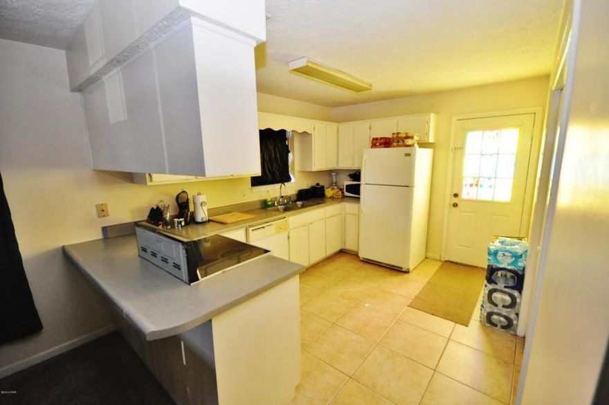 Completely updated in 2005. New roof in 2005 with 25 year shingles. 2 BR's, 1 Bath, 800 SF. Fenced yard, nice landscaping. Excellent rental potential. Make an appointment to see this one. Just off Michigan Ave, Walking distance to School, McDonalds. 5 minute walk to the Bay. 2 minute ride to ST Andrews Marina where you have shopping, restaurants, fishing, boating and so much more. The St Andrews Mardi Gras Parade is the best in the area. All measurements are approximate. Please measure if important.