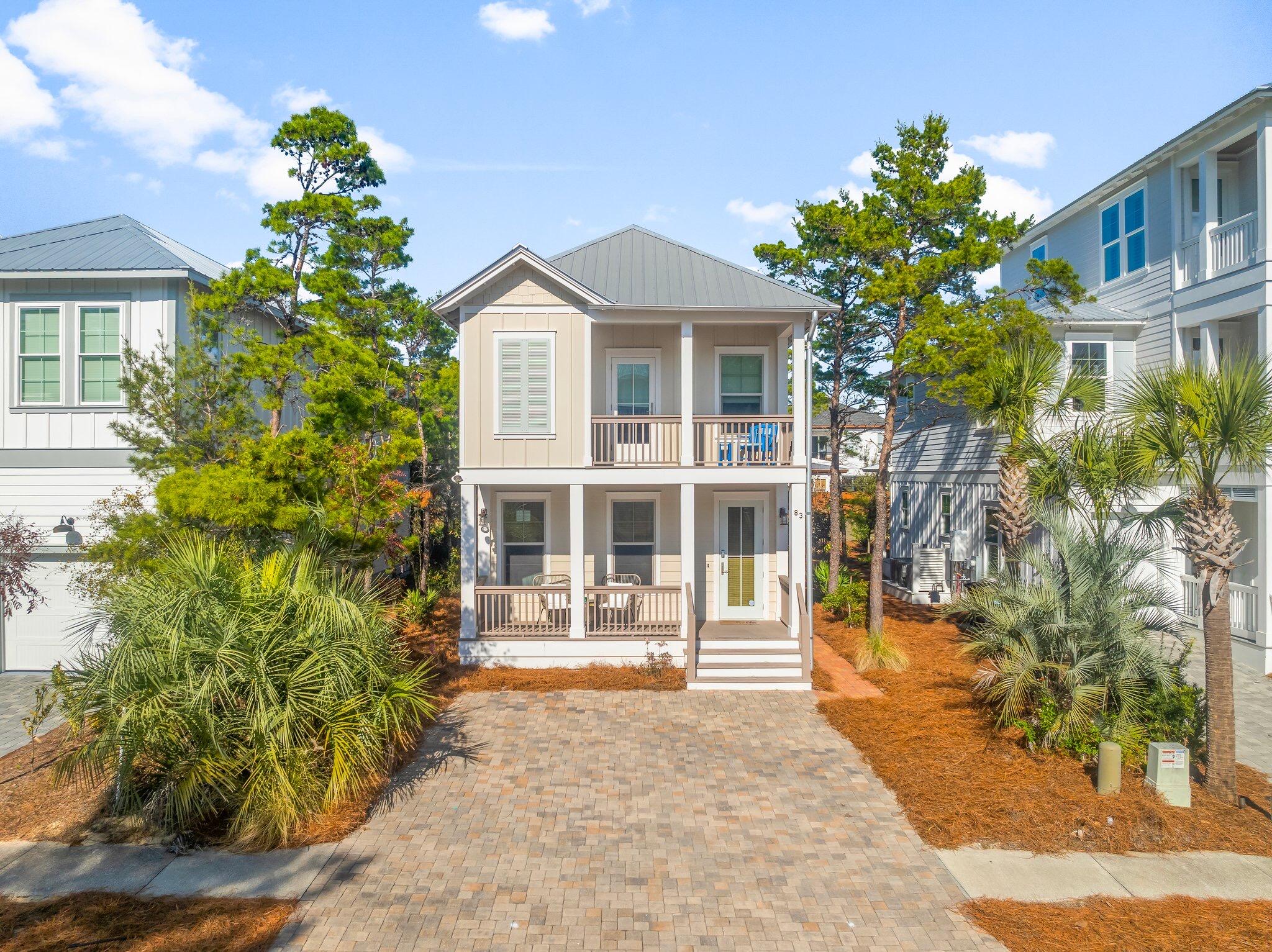 Beach House built in 2016 is  in close proximity to beach  & activities of Gulf Place. The front porch welcomes you into the open and spacious Living, Dining & Kitchen area.  Hardwood floors are featured throughout the entire house, except for tile in all baths.  Finishes include  6'' base boards & crown molding, granite countertops, stainless appliances, soft close cabinets & drawers. The home offers four bedrooms, with a guest bedroom on the main floor.  Upstairs is spacious  primary bedroom with walk-in closet, ensuite bathroom & private porch. The second floor offers 2 additional guest bedrooms w/ Jack & Jill Bath.  Walkable to the beach and a short stroll to the community pool, the property would be  for a great rental, second home, or primary residence.  Schedule a showing today!