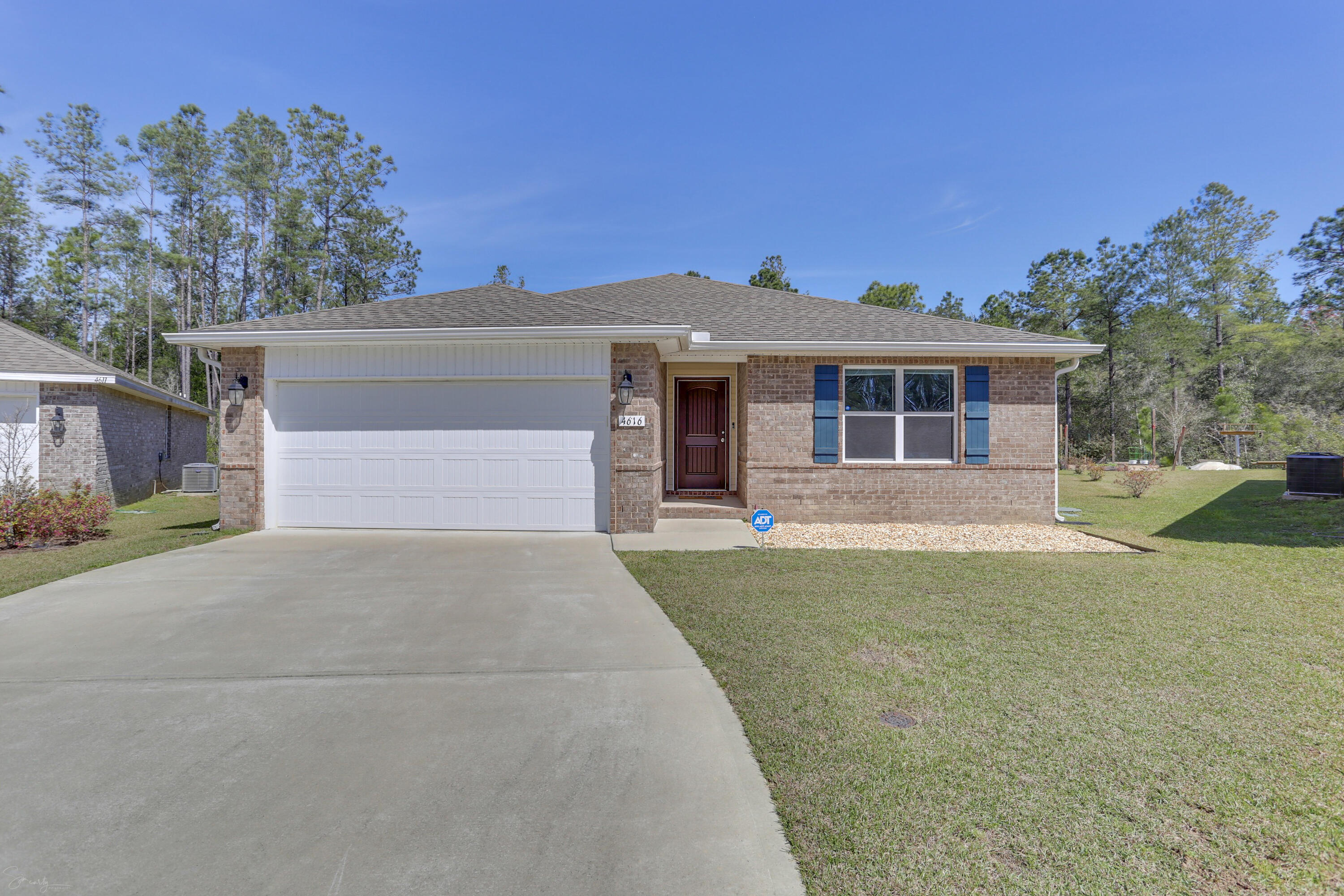 Craftsman style home built in 2019. This beautiful home is located in the Whisper Creek subdivision, backs up to a conservation easement allowing for the privacy your family desires Close to schools, shopping and family activities in Milton,Pace, Pensacola. Great open floor plan that flows from the living area into the kitchen and dining area. Owner's suite is roomy with private bath, double vanities and walk in closet. The additional bedrooms are good size and share a full bathroom. Two car garage. The seller installed the ADT system and Rainsoft Water Filter System with a spigot at the kitchen sink. Home is NOT in a flood zone. Welcome Home!