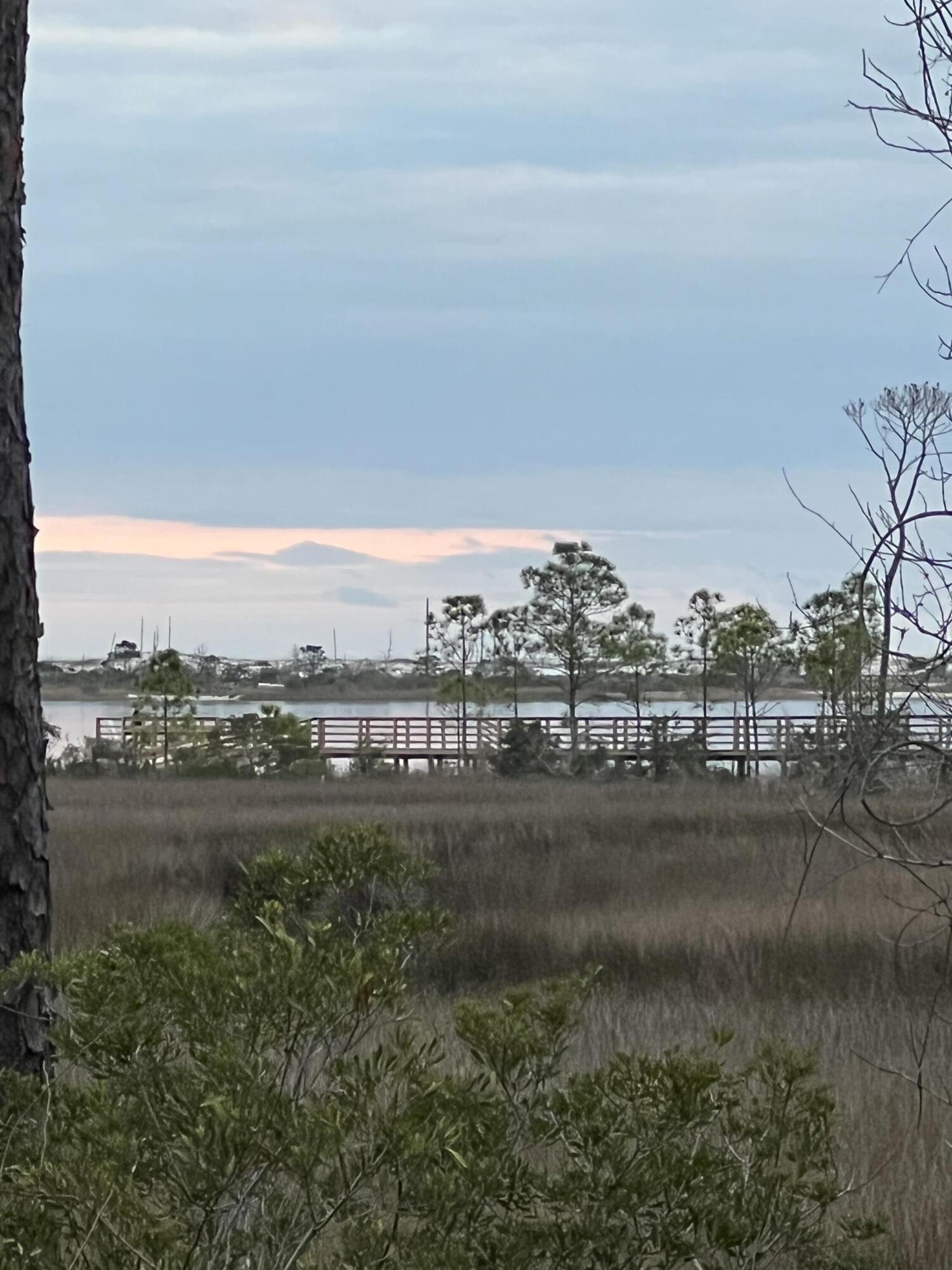 One of a kind! This home sits on almost an acre surrounded by nature and provides considerable privacy and seclusion. While you'll feel right at home and ready to entertain inside this well maintained home you'll feel equally ready to enjoy the great outdoors on your very private lot and water access by way of community beach. The views to the intercoastal from your family room, master bedroom and back patio are expansive and unobstructed. Ariel drone photos and video available on requestThe home has a new roof in 2021, new appliances and water heater within the last 2 years and the AC is approximately 8 years old. Tile & high quality laminate throughout.Currently insured for less than $1700 a year. Flood insurance not required. Call your agent today to schedule a viewing