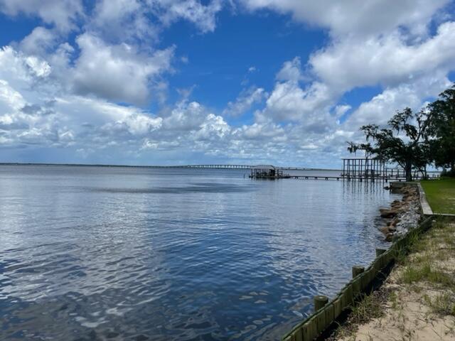 Seller is in the process of completing a lot split. Lot will be approximately 90 feet on the bay and 200 feet deep. Lot is a secluded, wooded, bay front lot that has endless possibilities. Seawall already in place. Lot is ready for you to build your dream home and enjoy the sunsets and all that living on the bay has to offer.
