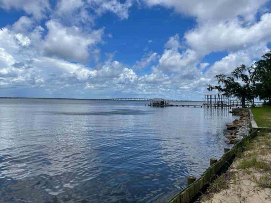 Seller is in the process of completing a lot split. Lot will be approximately 90 feet on the bay and 200 feet deep. Lot is a secluded,  wooded, bay front lot that has endless possibilities. Seawall already in place. Lot is ready for you to build your dream home and enjoy the sunsets and all that living on the bay has to offer.