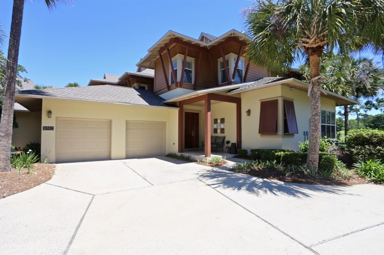 This spacious 3 bedroom townhome features an open floor plan. Boasting a covered porch with a fabulous view of the Baytowne Golf Course, this tranquil residence provides a perfect setting for overlooking the multiple golf holes on which it is situated. Ten foot ceilings, eight foot mahogany French doors, and lush landscaping are just a few of the draws of Magnolia Bay! The home includes two master suites, one on the first level and one upstairs, as well as another bedroom with en suite bath, and an additional half bath. The spacious 2 car garage allows for plenty of extra storage and parking. This home is in the perfect location- tucked away enough to provide quiet and comfort, but within walking distance to the neighborhood pool, 113 slip marina, world class tennis