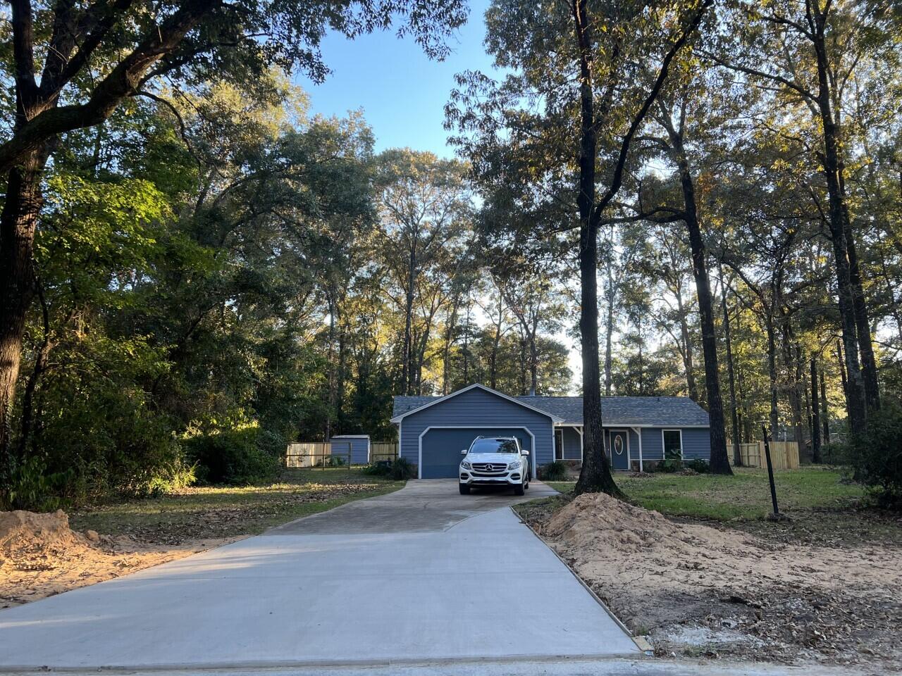 HOLLY HILLS has been a most popular neighborhood since its origin, due to the close proximity to town, schools, and shopping, yet with a lovely country atmosphere. The beautiful large hardwood trees of the neighborhood set it apart from so many others. This BEAUTIFUL home has been gutted to the stud and remodeled. Boasting NEW roof, AC/HEATING unit, appliances, sheetrock, baseboards, custom cabinets w/ soft close drawers, recess lighting, lighting fixtures, interior electrical panel, all electrical switches and covers, 17in toilets, sinks, showers, custom vinyl plank flooring throughout, granite countertops in the kitchen, quartz in the bathrooms, doors, hardware, 50 gallon water heater, portion of driveway, spray foam insulation in the roof, insulation in exterior walls and front door.