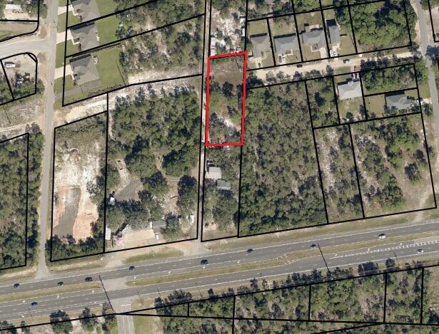 Prime Development Opportunity on Hwy 98! Sale includes approximately 0.55 acres from the rear portion of the parcel at 5104 Gulf Breeze Parkway. This cleared, partially fenced land features a 12' x18' workshop and is zoned HCD/R1M allowing for a variety of residential or commercial uses. Utilities are available, and the site offers 50' of road frontage on Aqua Vista Drive as well as excellent ingress/egress with potential for Hwy 98 signage frontage. Surrounded by established rooftops and commercial users, this property is ideally located directly across from Pensacola State College and just 3 miles east of Walmart, Lowe's, and Publix. Convenient access to I-10 via Avalon Blvd or the Garcon Point Bridge, and only minutes to Pensacola or Navarre Beach. Whether you're looking to develop, ex pand a business footprint, or invest in high-traffic land, this parcel offers both visibility and versatility in one of Gulf Breeze's most strategic locations. Legal description and parcel ID to be updated upon completion of new survey.