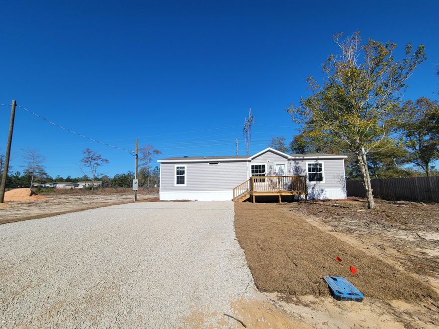 A beautiful new home is here just for you!  Call today and view this 2022 brand new manufactured home with 3 bedrooms and 2 full baths, new appliances and much more.  Extras such as a front and back deck have been added.  This property is eligible for Conventional, FHA and VA. Eglin AFB, Niceville, mid Bay Bridge appx 25-35 minutes away and Destin beaches.