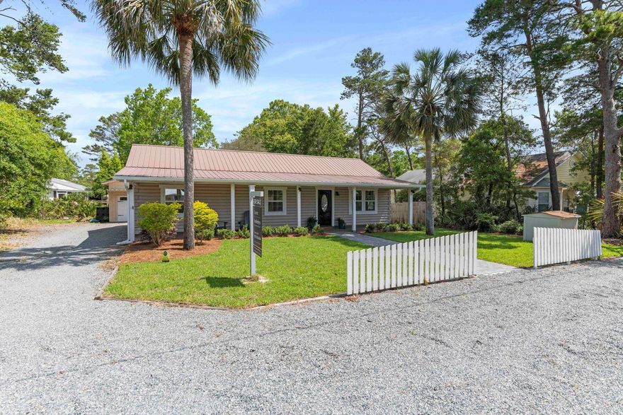 Located along Scenic Highway 30A just a few short blocks from the Gulf of Mexico, this charming cottage has been meticulously maintained and recently refreshed. Positioned as a great full-time residence, second home or rental investment, this spacious property encompasses a two-bedroom main home, a one-bedroom apartment and a one-car garage, along with various venues for outdoor living and a fully fenced-in backyard. An inviting, newly installed paver pathway leads from ample parking through fresh landscaping onto the expansive front porch. Freshly painted interiors, luxury vinyl plank flooring, built-in cabinetry, coastal decor and a nicely designed layout add to the apparent quality of this home.