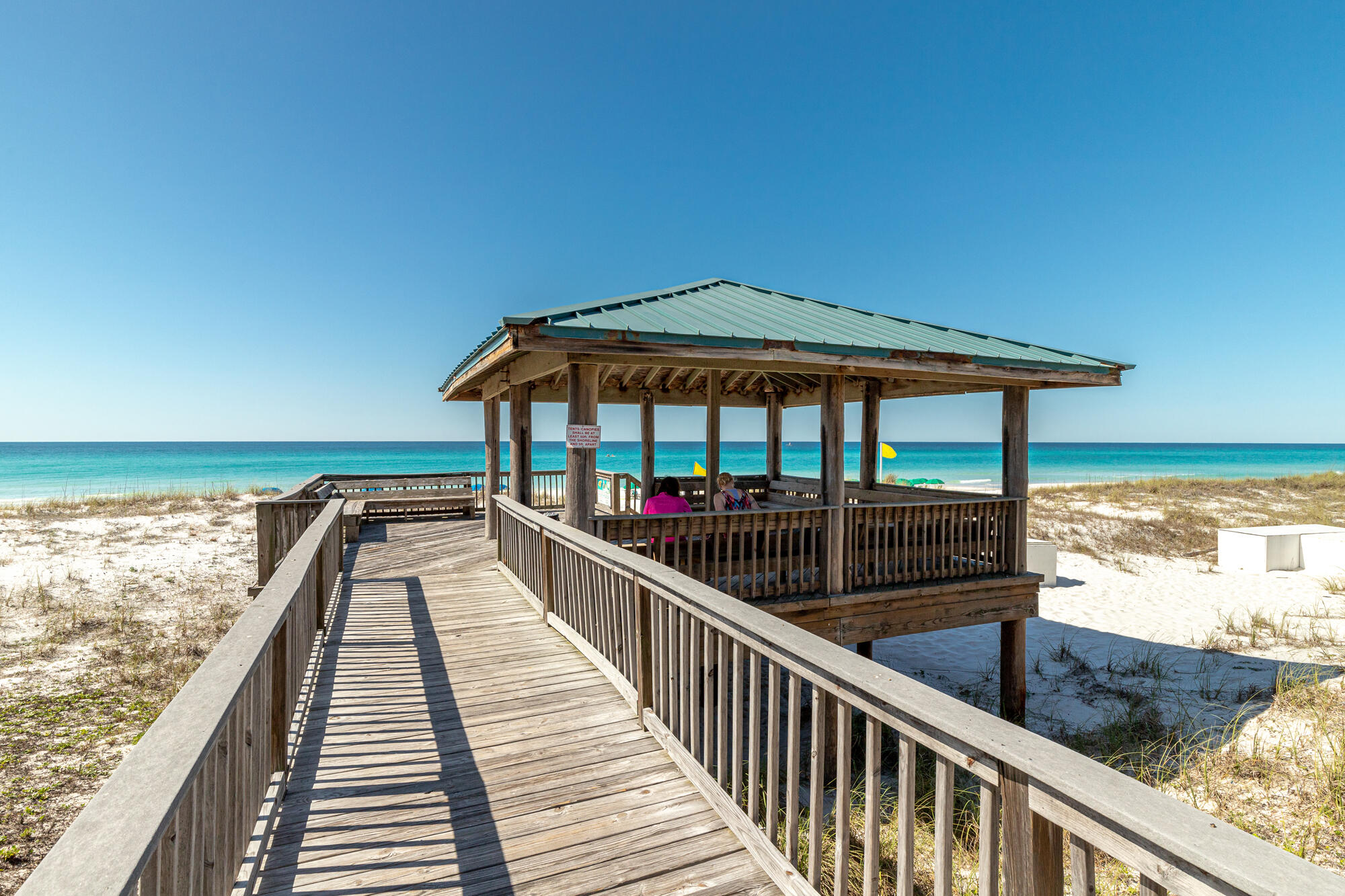 This fully furnished Unit 43 at Gulf Winds East has been thoughtfully updated and offers a spacious floor plan designed for both comfort and investment potential. The owner has recently installed new floors, and the unit features two master-sized bedrooms, two full baths plus a convenient first-floor half bath, a remodeled kitchen, and both porches and balconies with Gulf views. Its prime location near the pool and just steps from the beach makes it perfect for relaxing coastal getaways. With rental projections between $50,000 and $65,000 annually, this property is ideal for generating strong vacation rental income while still enjoying it as a personal retreat. Gulf Winds East provides private deeded beach access with a Gulf-front gazebo, offering a quieter, semi-private stretch semi-private stretch of beach with fewer crowds than public access points. Perfectly located on Scenic Highway 98, the community is also within walking distance of popular local favorites such as Pompano Joe's, Captain Dave's on the Gulf, and Kenny D's Beach Bar & Grill.