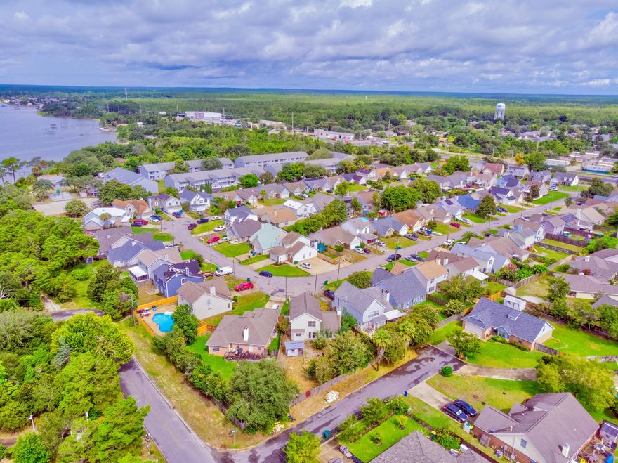 Motivated Seller! New roof being installed! $7,000 towards buyer's closing costs! Fall in love with this NEWLY updated 3brm/2.5ba, 2 story home just minutes from Hurlburt Field. This home features a spacious living room with a wood-burning fireplace and beautiful French doors that look out to the huge back yard. The formal dining room has lots of natural light. The kitchen has stainless steel appliances and a pantry closet. Gorgeous wood laminate flooring throughout the entire house. The master bedroom is very roomy. The master bathroom features a  vanity and a walk-in closet. The second and third bedrooms are a great size. The back yard has a shed w/ electricity and a workshop. The home has sentricon termite protection. A new garage door and water heater was installed last year.  Hurry!