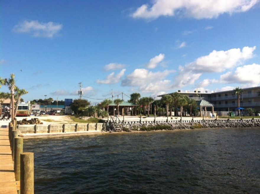 Prime Commercial Waterfront lot. 163+- feet on the sound. The property has a small outdoor tiki hut, food truck and a watersport company on the property that may be interested in leasing the property from an investment buyer.