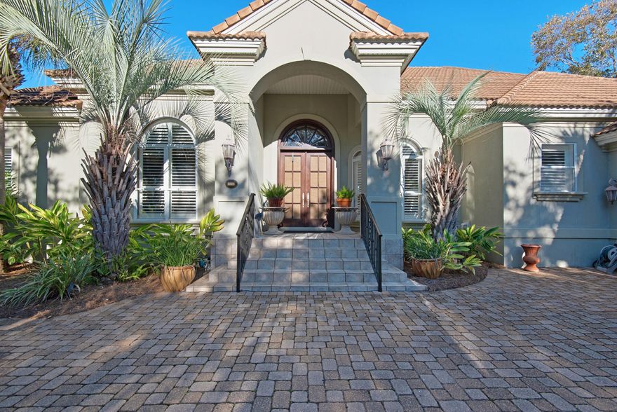 Welcome home to this classy Mediterranean home nestled in the heart of Regatta Bay on a quiet .49-acre lakefront homesite. The double mahogany beveled glass front doors welcome you into a spacious living area featuring 13 and 14 ft tray ceilings with extensive crown molding and French doors to the poolside paradise. The designer kitchen includes a breakfast bar, center island, recent stainless appliances, an abundance of cabinets, and elegant granite countertops. The backyard oasis enjoys a heated swimming pool, screened enclosure, and covered lanai with plenty of room for grilling and outdoor entertaining. The 3 bedroom, 3 1/2 bath floorplan boasts a split master suite, private baths for the 2nd and 3rd bedrooms, separate living and family rooms, and two dinind areas.
