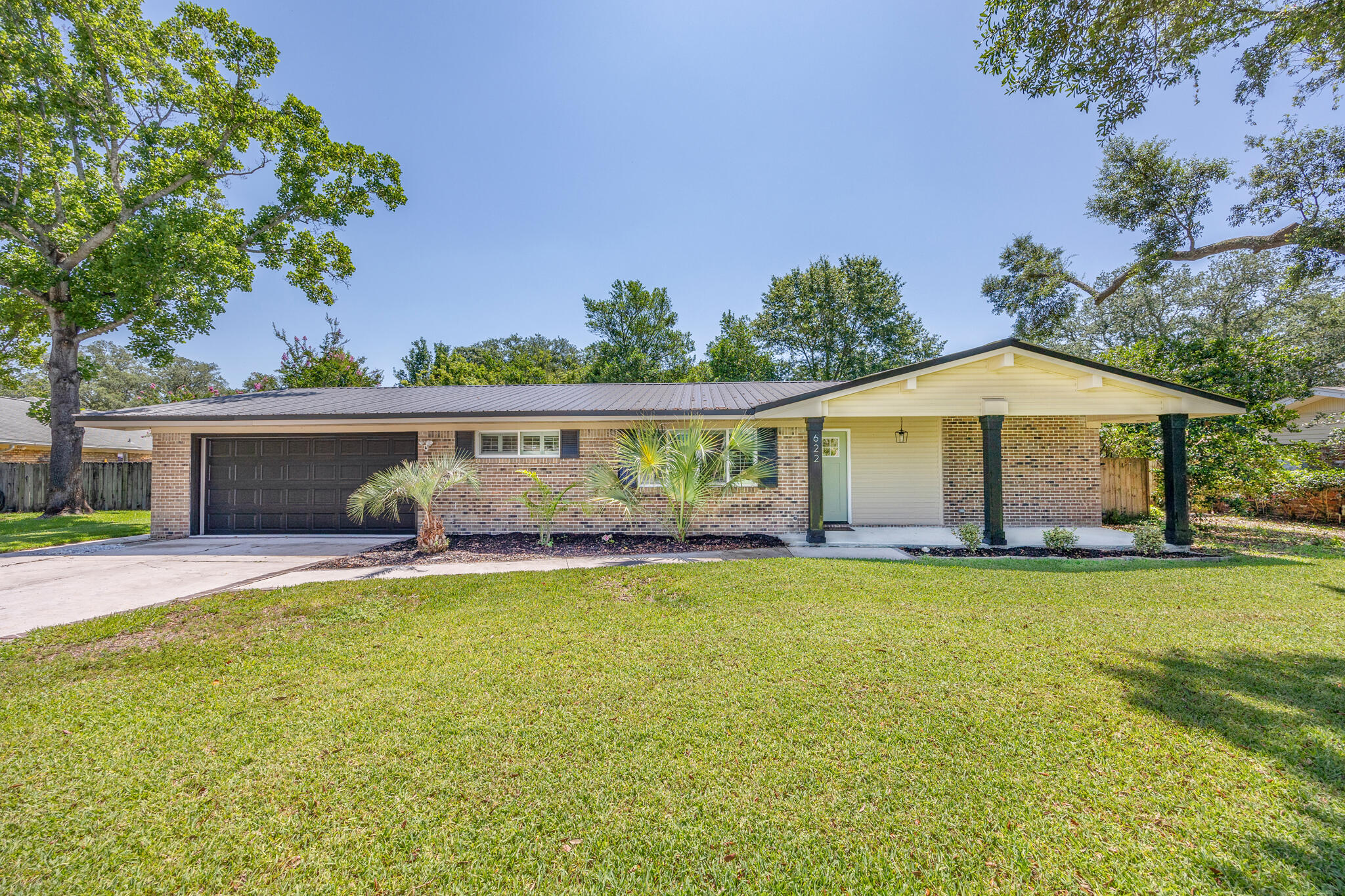 Great location!! Don't miss this 5 bed/3 bath pool home in the desirable Kenwood subdivision. Open concept with vaulted ceilings, a fireplace in the living room, vinyl plank flooring throughout and tile floors in the bathrooms. Stainless appliances in the kitchen with a custom 16 ft island countertop for entertaining and plenty of cabinet space. A large master suite and a second ensuite; both walk out to the back patio area with the heated pool and private, fenced in backyard. Metal roof from 2020, 2018 HWH, brand new 2024 HVAC, and sprinkler well drilled in 2025. Walking distance to the elementary school and minutes to Military Bases, restaurants, shopping and the beautiful beaches.