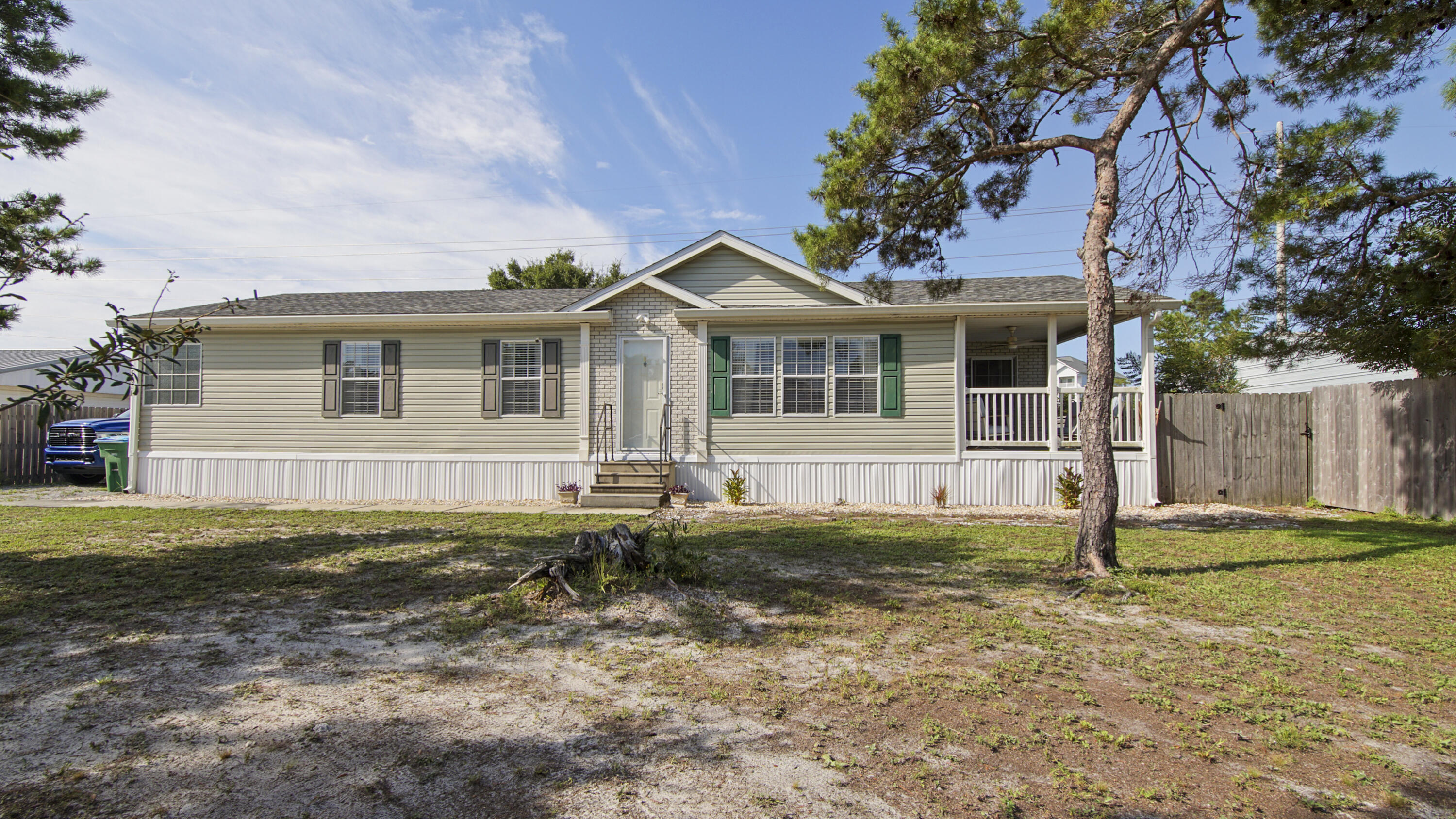 Well Kept mobile home in desirable neighborhood on Panama City Beach, Close to shopping, entertainment and Recreation, this home offers a spacious living area, separate dining and kitchen, 3 spacious bedrooms and HUGE master bathroom and Master closet, Fenced back yard with a shed and a great sitting porch for sitting out side listening to the birds as you sip your coffee in the morning.