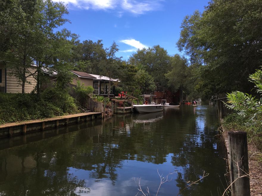 This 4 Bed / 3 Bath cottage. The property is located on a canal that leads directly into the Choctawhachee Bay. Very easy boating access to Sandestin and Destin from this location. The house has been vacant and was purchase as an REO recently. The owner planned on doing the complete remodel, but health issues have come up. The properties first floor features a lockout and full kitchen. The yard is fenced and has numerous wonderful trees. This is a fixer upper and will need some construction work to be completed. The buyer must satisfy themselves to all aspects of this property, house and size. Property being sold AS-IS.