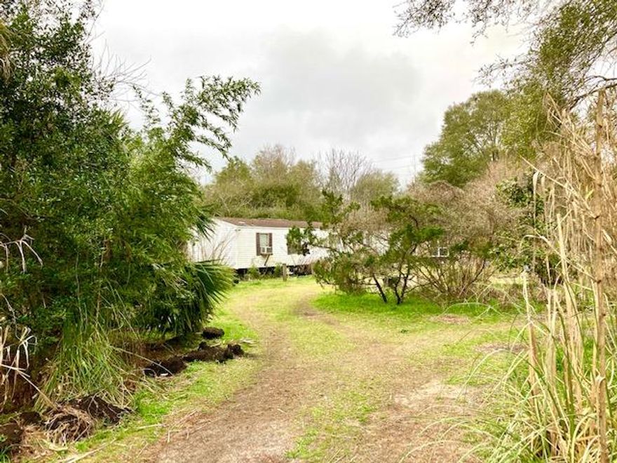 TWO LOTS ON HIGHWAY 90W, JUST 6 MILES WEST OF DEFUNIAK SPRINGS.  There is a 2BR 2BA mobile home on the property that, due to some wood rot and structural issues is being given no value, although it may be able to be fixed up.  The house has no central heat & air. There is a nice greenhouse with concrete floor on the property and several other sheds.  There is also an unused well on the property.  The mobile home is connected to Mossy Head Community Water, CHELCO Electric and has a working septic tank.  There is an old survey of the property in the file. Both lots are enclosed by a high chain link fence. This property will by necessity need to be a cash deal.  Seller is firm on price. All dimensions and square footage are approximate and subject to verification by owner at owner expense.