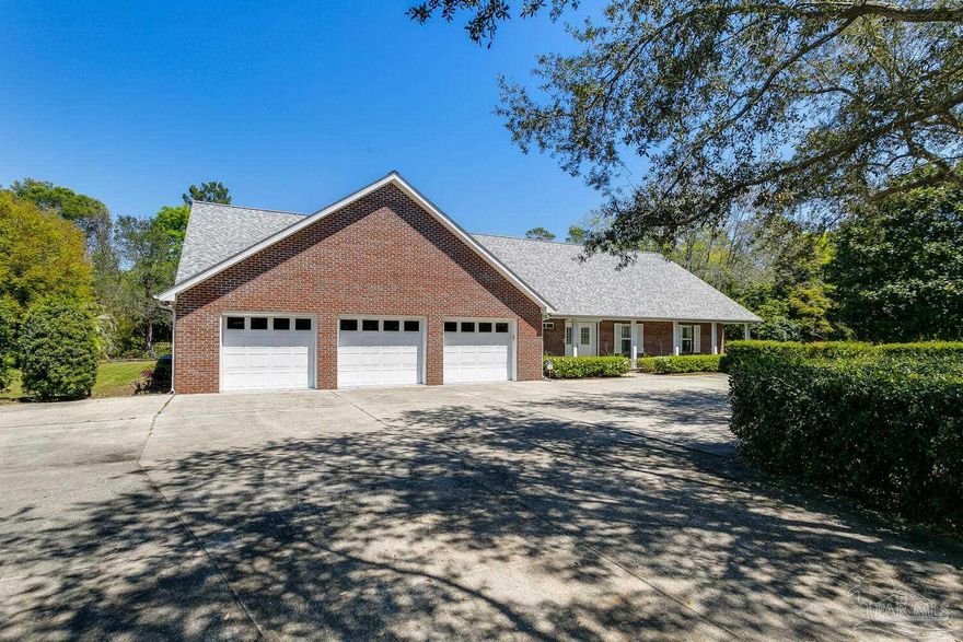 Come take a look at this at this incredibly spacious, custom built, hurricane proof home in Holley By The Sea! Did I mention it also backs up to the 10th Green at the Hidden Creek Golf Course? This huge home sits on a quiet circle off PGA Blvd. and has plenty of room for parking with its 3 car garage and additional parking in the oversized driveway. There is also a workshop attached to the garage that is air conditioned and equipped with power & water, great for working on projects! The homes exterior was built with YTONG Blocks that make it heat and sound insulated! The built in hurricane shutters are easy to use and convenient as well! When you walk in the front door you see beautiful hardwood floors and an office that has built in shelving with a desk. The kitchen and living area are