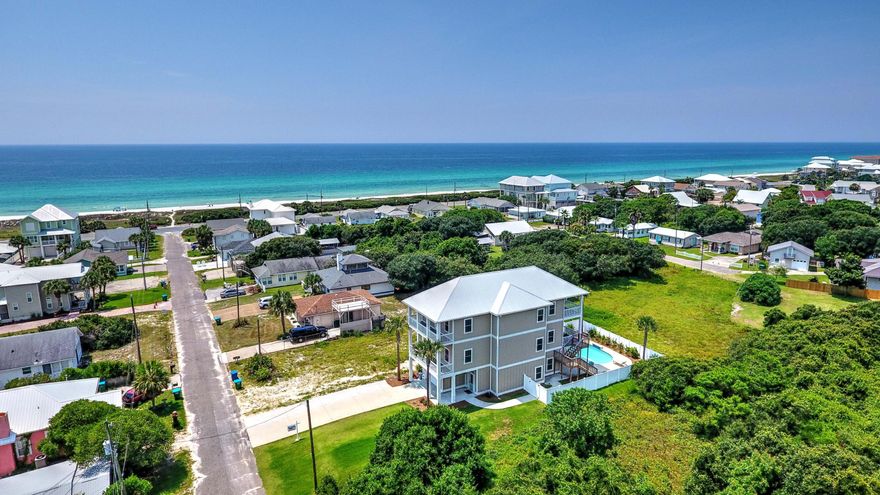 This 4BR/4.5BA Sunnyside home was built in 2016 and has a gulf view from the private balconies of each bedroom suite on the 2nd and 3rd floors! The sellers, when building this beautiful home, spared no expense and added an elevator and a private pool! Interior features include granite countertops, reclaimed wood accent walls, stainless appliances, some 10' ceilings, a bunk room, and all of the bedrooms have walk-in closets and private decks. The master suite is on the 3rd floor and the en suite boasts a walk-in tile shower with dual shower heads, a Jacuzzi tub and his-and-hers vanities! The backyard includes the aforementioned pool which is heated seasonally so you can enjoy year round! After a day on the beach, which is a mere block away, you can rinse off under the hot & cold outdoor