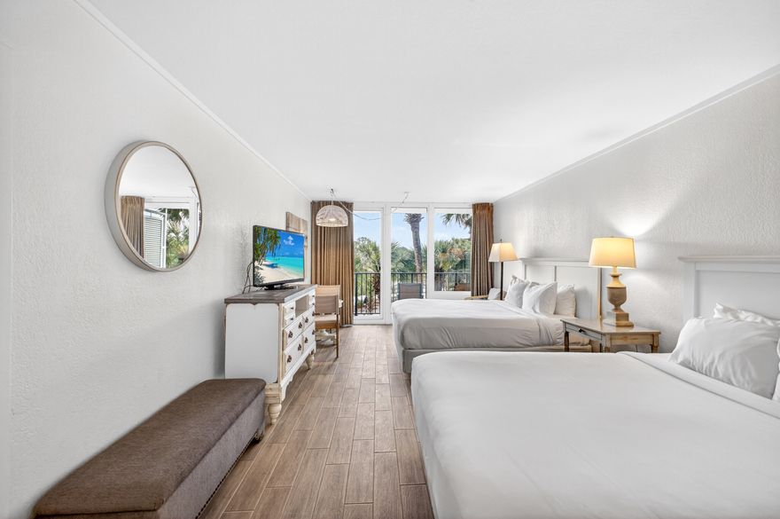 Renovated and rental-ready, this third-floor Bayside at Sandestin studio features coastal colors, tile flooring, and a marble-tiled shower. Offered fully furnished with two queen beds and a kitchenette with mini-fridge, sink, and microwave. Step onto your private balcony and enjoy stunning sunset views. Strong rental history with actual income in Documents. Ideally located near the Links Golf Course, Conference Center, and Fitness Center, with easy access to the tram for the beach and Baytowne Wharf. All utilities included; only contents insurance needed. As an introduction to the Sandestin lifestyle, we invite our new owners to explore amenities that make Sandestin special. The listing brokerage and seller(s) are presenting the buyer(s) of this property with (2) 90-minute rounds of Tennis court time, a golf foursome at one of our three championship courses, and a round of golf for up to four (4) players at the unrivaled Burnt Pine Golf Club.
Sandestin Golf and Beach Resort features more than seven miles of beaches and pristine bay front, four championship golf courses, 15 world-class tennis courts, a 226-slip marina, a fitness center, spa and celebrity chef dining. Shop, dine and play at the charming pedestrian village, The Village of Baytowne Wharf and more. Inside the gates of the resort, residents enjoy a balanced lifestyle of high-class living, spanning the 2,400 acres from the beach to the bay. Everything within the gates of the resort is accessible by golf cart or bicycle. The entire resort is interconnected by miles of pedestrian, bike and golf cart paths that weave through groves of live oaks, meandering past natural lagoons, fountains, man-made lakes, and meticulously landscaped fairways.