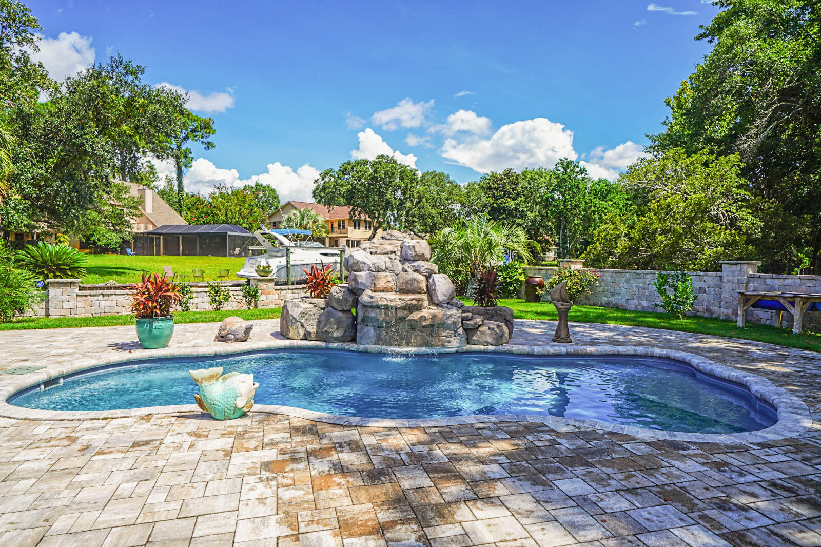 Hidden Gem on the Florida Panhandle! A boating paradise with your own boat launch, boat dock with lift and jet ski lift and dock. This home is on a half acre with 300 feet of protected waterway just off of the inter-coastal with views of the Gulf of Mexico and boating access to all your favorite waterfront dining spots in Destin, Fort Walton Beach or Navarre. Looking for a place to store all your treasured vehicles? This beauty has two heated and cooled garage spaces with raised office space and commercial grade garage doors. This home has been renovated in the last few years with finishes that are one of a kind. This three bedroom, three bath home boasts three fireplaces, a bonus room and a chef's kitchen with Blue Star commercial appliances. Portifina quartz, custom solid wood