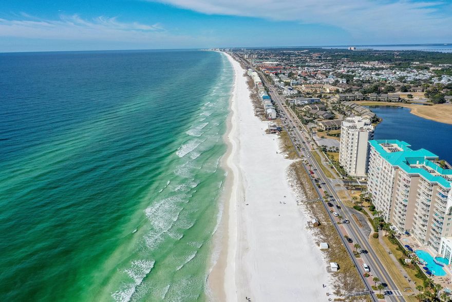 Highest and Best Due by 5pm on 2/25. Your new gated beach community is here! This stunning 'Beach Retreat' is one your friends, family and vacationing guests will enjoy for a lifetime. Enjoy 2,000 feet of private beach just minutes away from your unit. The boutique kitchen showcases storybook white shaker cabinets, stainless steel appliances, endless granite counter tops, and a custom backsplash. The living room and dining room boasts a gorgeous ship-lapped vaulted ceiling w/ wood beams. This unit features tile, LVP flooring throughout and new furniture! Located in a gated community and just a few steps away from the pool, tennis courts, and your private beach. Take in endless sunrises and sunsets from your private top floor deck surrounded by 330-acres of beachfront, nature and adventure.