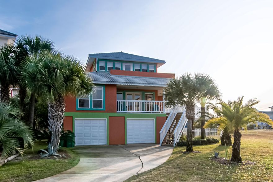 Gorgeous beach house located in the Village at Navarre. Comprised of three stories this home offers a boat slip, garage, 4 bedrooms and 2 bathrooms. The second floor features a spacious main living area, kitchen, dining area, two bedrooms, a full bathroom and a wraparound porch that's perfect for entertaining or immersing yourself in the ocean breeze. The master suite is located on the third floor allowing for ample privacy. The master suite boasts a vaulted ceiling, walk in closet, a full bathroom, and a private balcony. Outside features a fenced yard, allowing plenty of room for relaxation or play! The community pool, dock and boat slips are a short walk from this home. Currently operating as a successful vacation rental making this home perfect for investors!