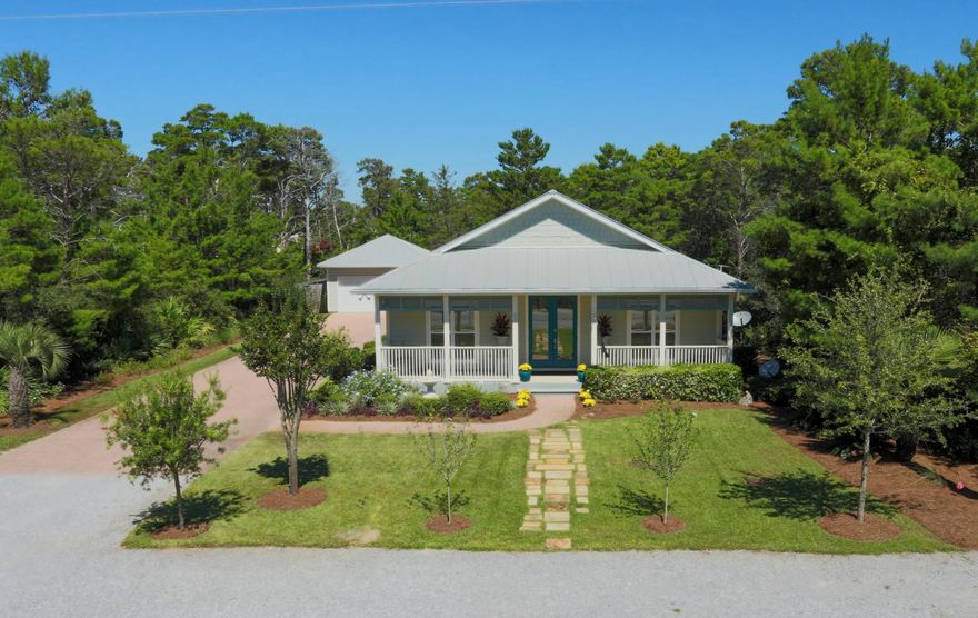 Beautiful, up-to-date beach cottage just off of Scenic 30A. The open-concept living/dining/kitchen with vaulted ceiling offers amazing space in which to relax and entertain. Clean, stylish finishes including easy-to-clean tile floors and modern paint colors make this home move-in ready! The kitchen features stainless GE appliances, granite counters, attractive cabinets, a large breakfast bar, and a large walk-in pantry/laundry room. A wide hallway connects the common areas to the bedrooms and back porch. The lovely master suite includes a raised ceiling in the bedroom, a luxurious jetted tub, dual sinks, and walk-in closet. Both additional bedrooms also have large closets. The outdoor living spaces are designed for easy living as well: a southern-style front porch; large, fully