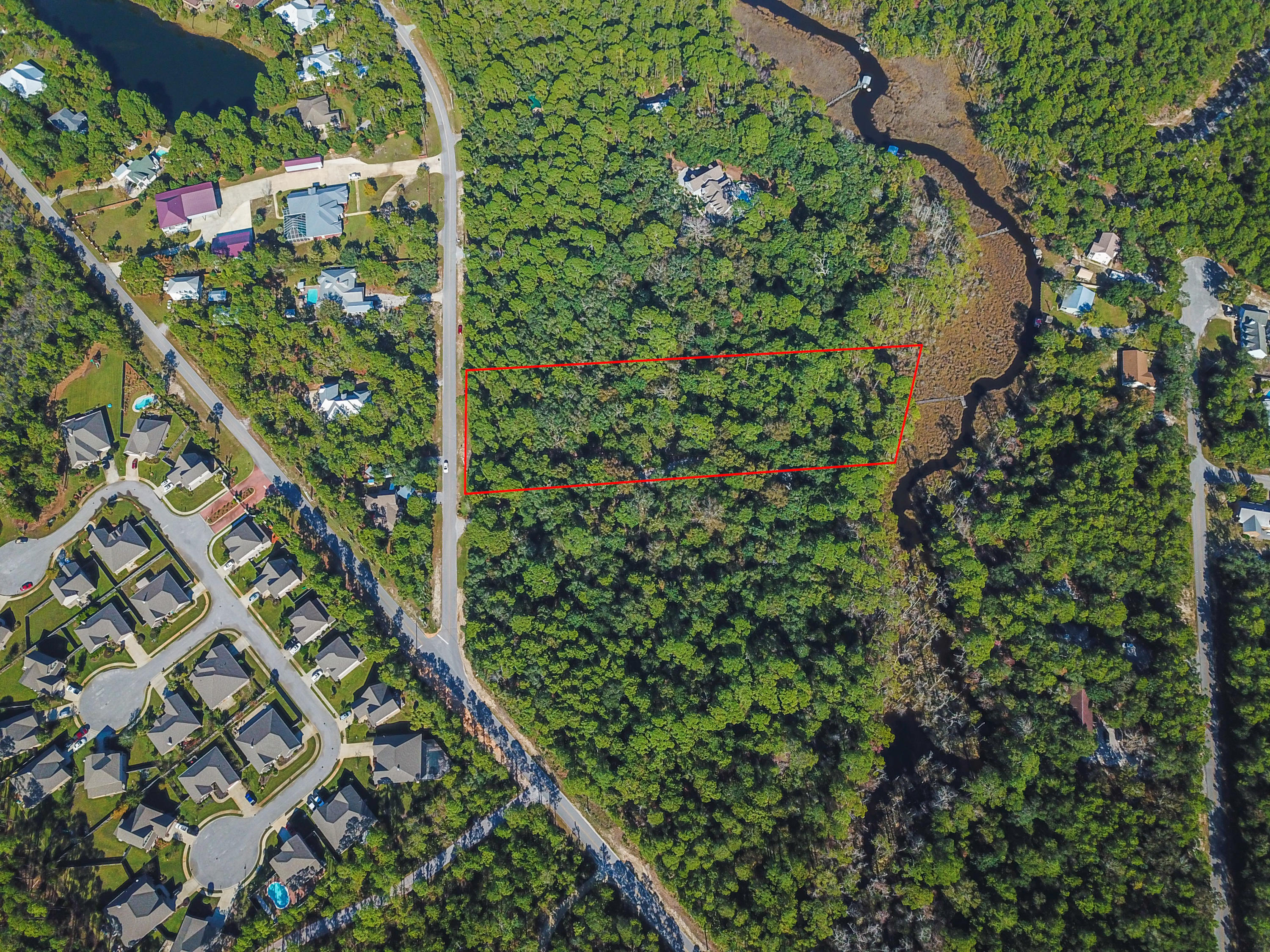Create the ultimate waterfront lifestyle at this picturesque 2.8-acre homesite with 214 waterfront feet on Mussett Bayou and a dock with boat dock in place in Woodland Bayou Estates in Santa Rosa Beach. Natural beauty abounds with magnolias, oaks and tall pines while Mussett Bayou provides direct access to Hogtown Bayou, the Choctawhatchee Bay and beyond. Woodland Bayou Estates is a peaceful neighborhood nestled towards the end of Don Bishop Road with established neighbors and nice homes. Centrally located to area schools and Sacred Heart Hospital on the Emerald Coast, the 30A beaches, Grand Boulevard town center and Sandestin community are all just a short drive away.