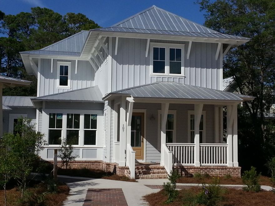 SPECTACULAR FLORIDA COTTAGE ON A PRIVATE LOT. Enter the home from the covered front porch. The family room opens onto a screened porch and features a fire place with custom book cases. The kitchen boasts gourmet appliances, custom cabinetry and granite work surfaces. A formal dining room, mud room, and guest bedroom suite are also on the first floor. The second floor master suite opens onto a screened porch and has a large shower, double vanities and a generous walk in closet. Two guest bedrooms suites are also on the second floor. The home will feature hardwood and tile flooring throughout and offer classic Florida cottage interior trim detail. Forest Lakes offers a community pool, stocked lake and a full facility public beach access is just minutes away.