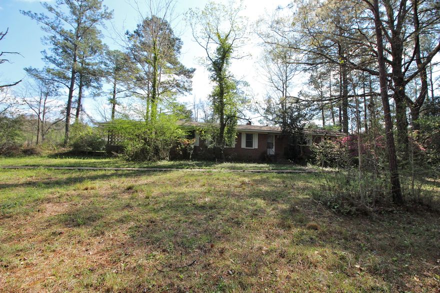 Sold before going to market and entered for comp purposes. Home is dated in appearance and in disrepair with major roof leaks in multiple places. Laundry is located in carport.