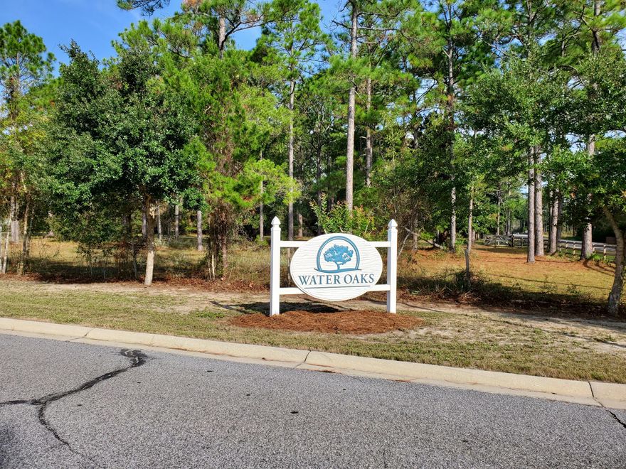 EXCITING OPPORTUNITY IN SANTA ROSA BEACH!! VACANT AND READY FOR MOVE IN! This spacious 3 bedroom 2.5 bath townhouse would make a great starter home or long term rental property. Easily rents for steady income of $1700/mo. Ideally located just a 5 minute drive to the beach, and central to shopping and dining of Santa Rosa Beach and 30A. Exterior coastal Florida cottage design is beautifully landscaped with tropical Florida foliage. Enter the home through the covered front porch with quaint sitting area. Inside you will find wood floors through the hallway and into the open concept living area. The kitchen is well equipped with stainless steel appliances, wood cabinets with crown moldings, granite counter tops, and a breakfast bar overlooking the dining/living area.