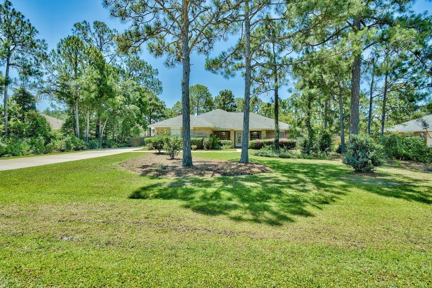 GORGEOUS, CUSTOM HOME, WITH 405 SF HEATED/COOLED FL RM ON ESTATE SIZE, PRIVATE LOT! Looking for a lushly landscaped spacious setting w/complete privacy? Natural, calming views.with Hydrangeas, Azaleas, Camelias? You've found it. Experience immediate relaxation as you enter this beautiful Home. Offering a large Great room w/vaulted ceilings, a separate Office area, 2 Dining areas & a giant 2 year old heated/cooled Fl. rm w/pavered floors, continuous windows & serene views, there's plenty of living areas to accommodate a busy lifestyle. The gorgeous Kitchen w/20 month old granite counters, backsplash & SS appliances opens to the casual Dining area & Great room.