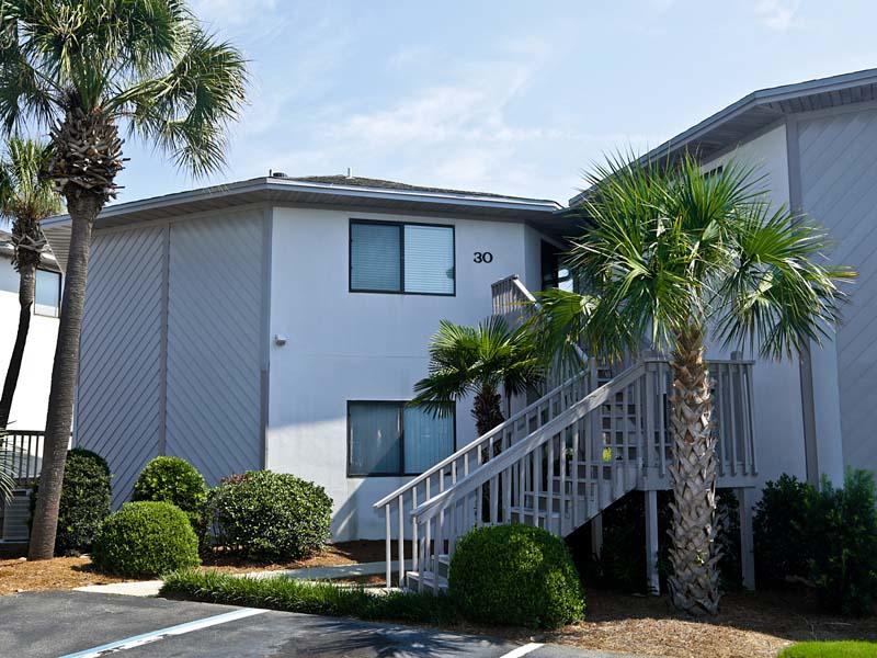 Unique 2BR/2BA unit just a short walk to the beach & close to the pool. This unit features tile floors in the living space and carpet in the bedrooms. The kitchen features refrigerator, plenty countertop space, large breakfast bar, & a utility closet with washer/dryer. The master suite has a private bath & nice sized closet. There is also an additional bedroom and a hallway bath. This unit is being sold fully furnished and rental ready. These are highly sought after, and this unit won't last. See you at the beach!