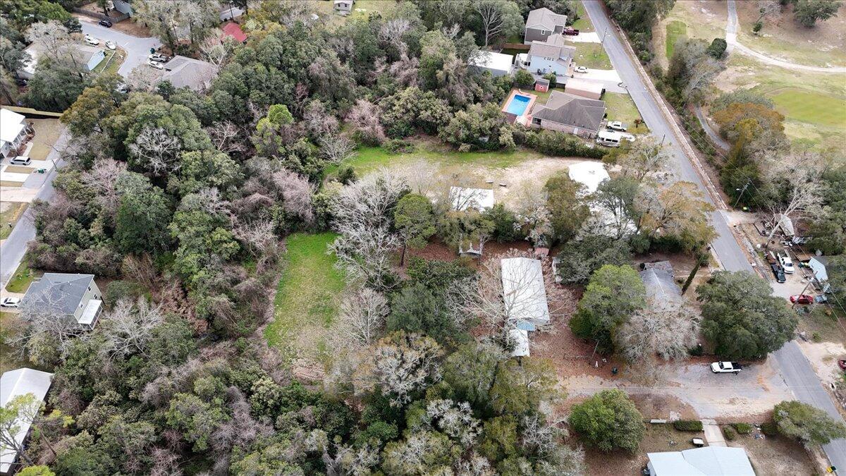 This listing includes two parcels which are currently plotted as 4 lots Parcel ID 06-1S-22-2100-0003-0080 which is .23 currently has a double wide on the lot that is in livable condition, together the land totals .88 of an acre. Utilities and septic on the property. Could possibly be split into four buildable lots with City approval. Double wide is a 1997 model with 3 bedrooms, 2 baths and two sitting rooms, it does need some work or could be removed.