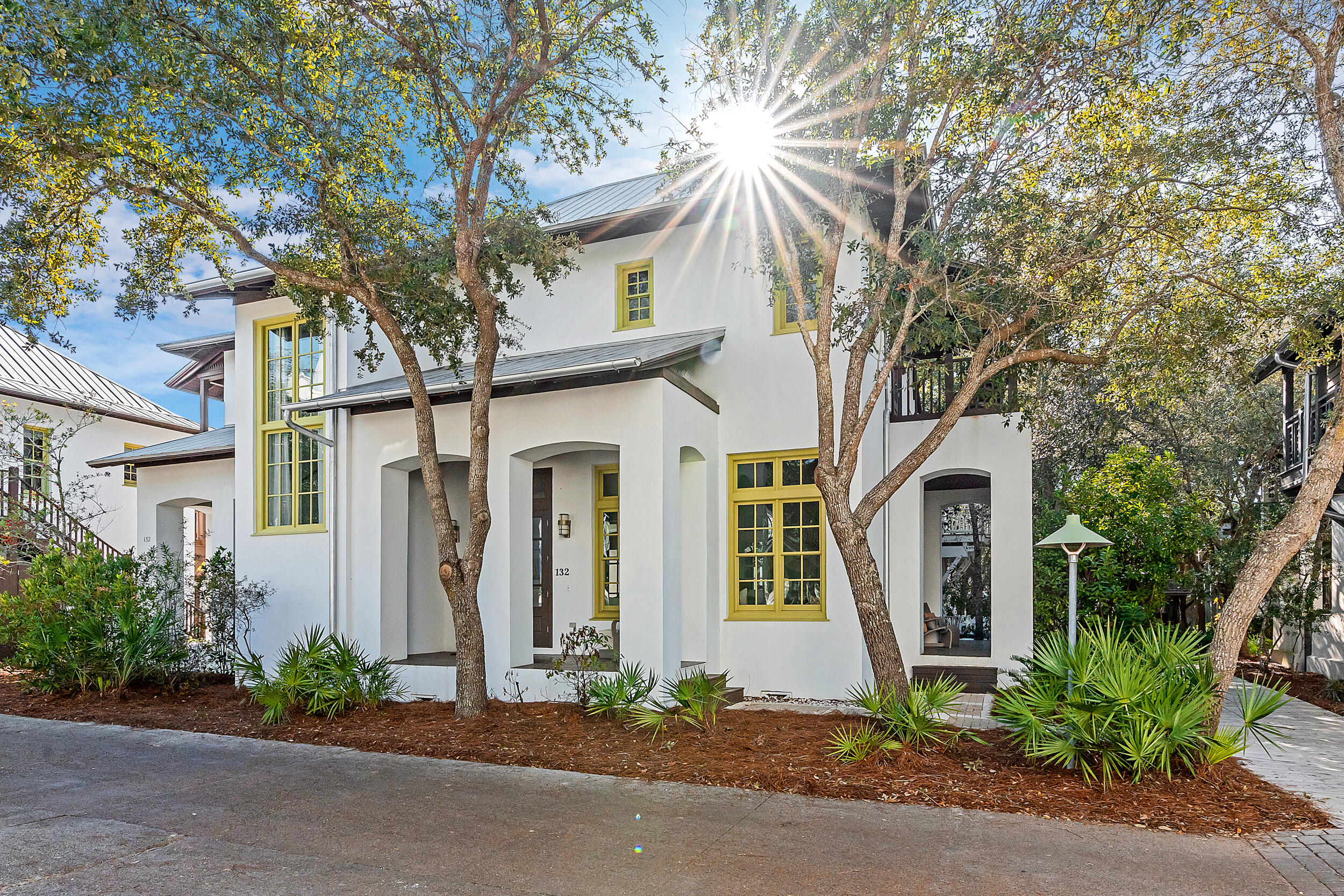 Elegant, oversized corner-lot retreat in Rosemary Beach featuring a stunning private courtyard with pool, outdoor fireplace, and dining loggia. The main residence offers an open-concept layout, renovated kitchen and baths, French oak floors, and en suite bedrooms with private balconies or porches. A separate carriage house with full kitchen sits above a two-car garage, perfect for guests or rental income. Masterfully built with all-block construction, transom windows, also featuring tankless water heaters, and custom finishes throughout. Parking is no issue with 4 parking spaces, 2 garage and 2 additional with carport! Located just moments from beach access, dining, and shopping. This is coastal luxury reimagined -- ideal as a primary home, vacation getaway, or high-performing investment!