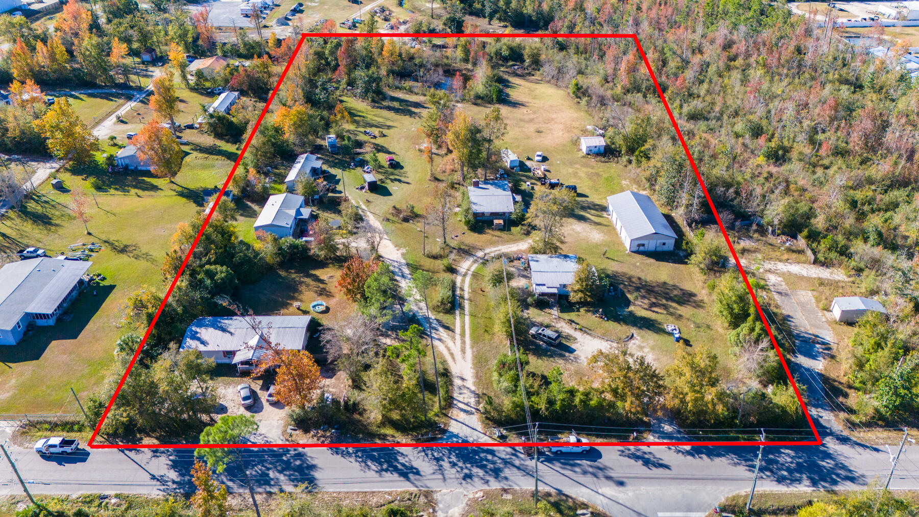 This property is a MULTI-FAMILY INVESTOR and DEVELOPERS DREAM! This 5-acre parcel currently brings in $4,000/month in income and has incredible potential for future development. Positioned in Lynn Haven, recently named one of the TOP 10 places to live in Florida, you'll find 5 acres zoned Medium Density that currently holds MULTI-FAMILY investment properties where all structures are occupied by tenants. Bringing in $4,000/month in income, this is a PRIME opportunity to cash flow from day 1 and hold the property for future development. 4525 Carla Lane offers 5 acres, zoned Medium Density Residential and density is 4-10 units per acre. Zoned for single family homes, duplexes, multi-family or group home - the possibilities are endless with this future development opportunity. 4525 Carla Lane offers 5 acres, zoned Medium Density Residential and density is 4-10 units per acre. Zoned for single family homes, duplexes, multi-family or group home - the possibilities are endless with this future development opportunity. 

This property includes 5 structures and are all occupied by tenants at this time. There is also a 30'x60' garage with 4 bays and roll-up garage doors. This garage is currently being used for storage by Owner but leaves opportunity to bring in additional income, if rented.

This property is located less than 1/2 mile from Trane Technologies and the Lynn Haven Sports Complex, within a few miles of Publix, Dollar General and dining and within 2 miles of North Bay Haven Charter Academy.

All information provided must be verified by Buyer, if important. Property is occupied by tenants. Please do not disturb tenants.