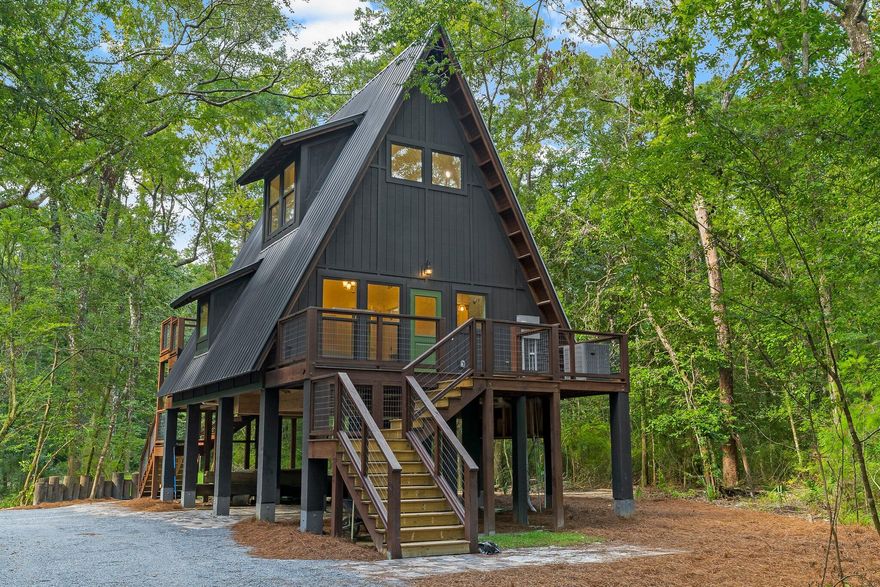 This stunning, brand new, tiny home is a modern farmhouse dream!! Located right on the Choctawhatchee River and in the woods, the privacy of your new home is a great escape from the busy, yet close enough to the beaches of South Walton and Panama City. Fully furnished, the main living area, kitchen and bathroom are on the second story with a large bedroom space on the third floor. Decks on both sides of the home and plenty of covered storage under the home. This home looks like it should be featured in a magazine with the attention to details and finishings selected.***New photos coming soon!***Loft access is by ladder or outside stairs